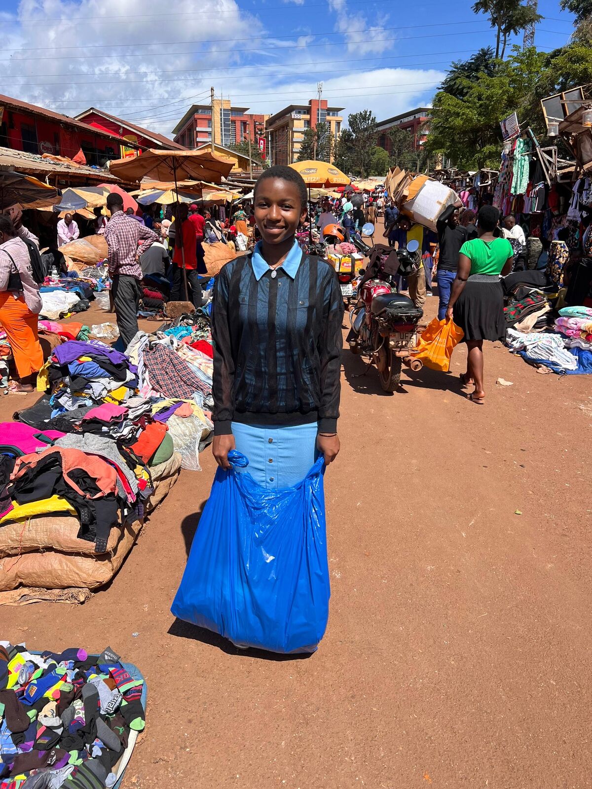 Team members visiting a local market in Uganda