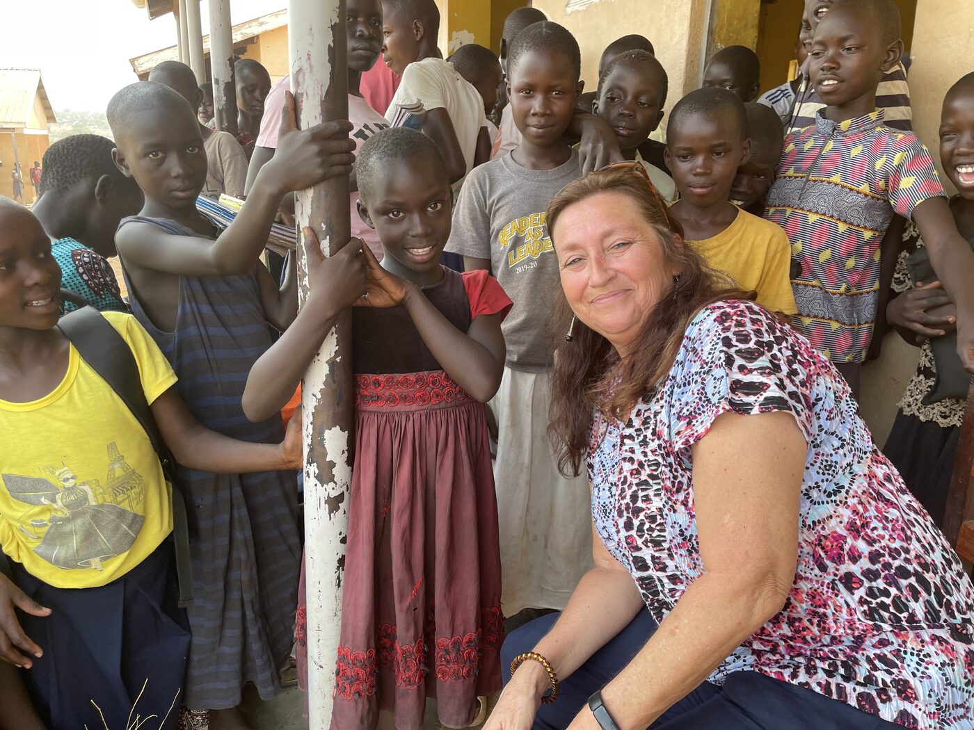 Susan Clem, Treasurer of Greater Heights Missions, visiting a school in Uganda