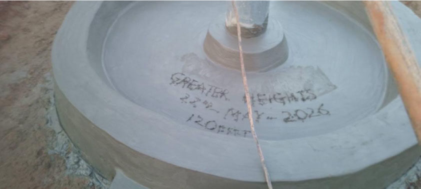 Concrete well cap engraved Greater Heights, dedicated May 27, 2026, 120 feet deep